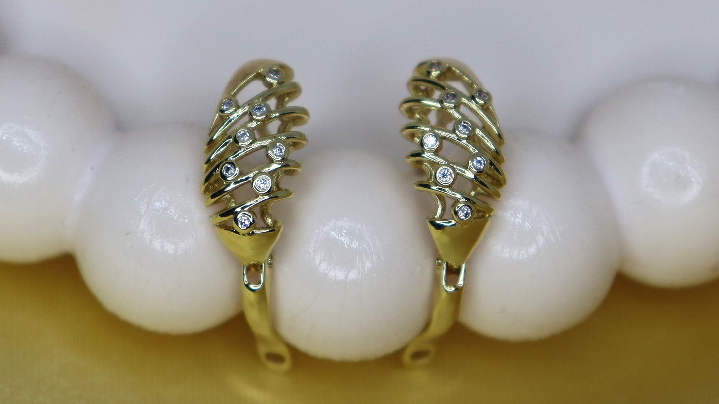 Pearl necklace with gold clasp on a white background